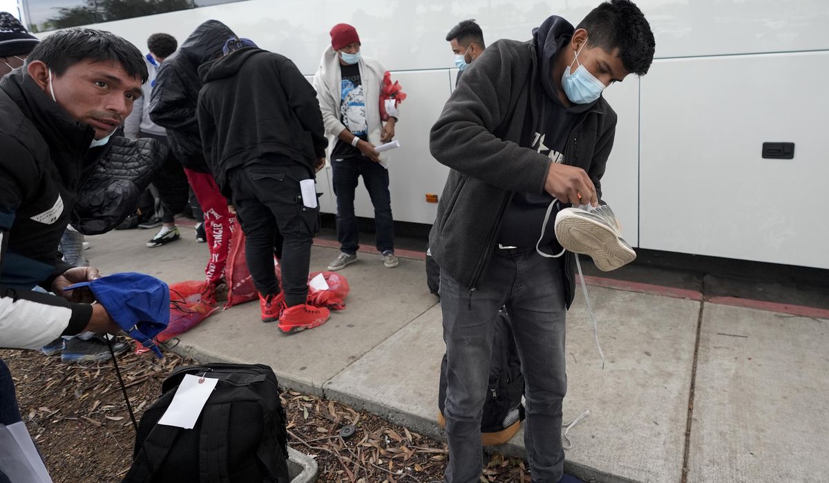 NextImg:Border Patrol releases hundreds of migrants at a bus stop after San Diego runs out of aid money