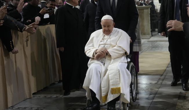 Pope Francis leaves after presiding over the liturgy of the ashes in the Basilica of Santa Sabina in Rome on Ash Wednesday, Feb. 14, 2024. (AP Photo/Gregorio Borgia)