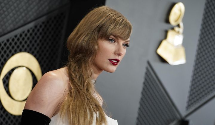 Taylor Swift arrives at the 66th annual Grammy Awards on Feb. 4, 2024, in Los Angeles. A photographer told police he was punched in the face by Taylor Swift’s father on the Sydney waterfront on Tuesday, Feb. 27, 2024, hours after the pop star’s Australian tour ended. (Photo by Jordan Strauss/Invision/AP, File)