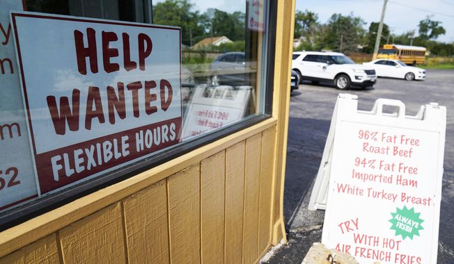 A &quot;Help Wanted&quot; sign is displayed in Deerfield, Ill., Wednesday, Sept. 21, 2022. (AP Photo/Nam Y. Huh)
