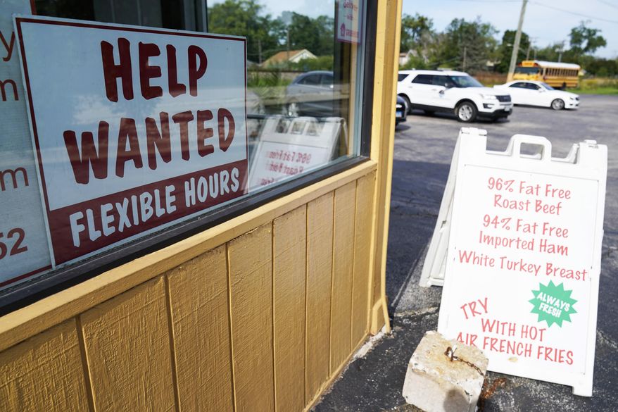 A "Help Wanted" sign is displayed in Deerfield, Ill., Wednesday, Sept. 21, 2022. (AP Photo/Nam Y. Huh)