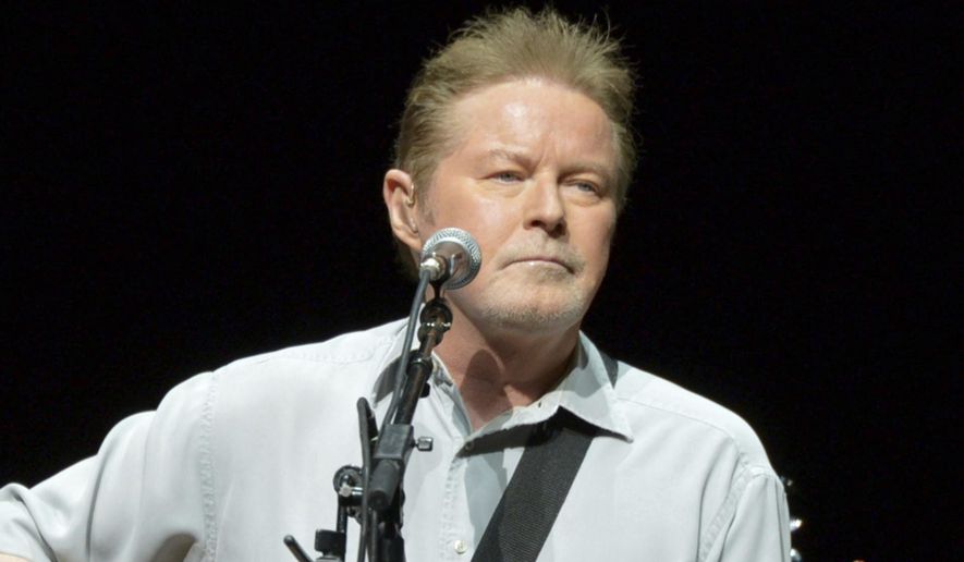 Don Henley of The Eagles performs on the "History of the Eagles" tour at the Forum, on Wednesday, Jan. 15, 2014, in Los Angeles. Henley, the co-founder of classic rock band the Eagles, is scheduled to testify Monday, Feb. 26, 2024, at the criminal trial of three collectibles professionals. They're charged with colluding to veil the questioned ownership of sheets of draft lyrics to “Hotel California” and other Eagles hits in order to sell them and deflect Henley’s demands for their return. (Photo by John Shearer/Invision/AP, File)