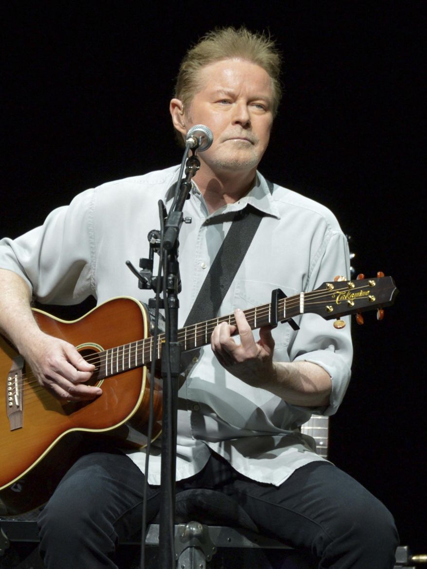 Don Henley of The Eagles performs on the "History of the Eagles" tour at the Forum, on Wednesday, Jan. 15, 2014, in Los Angeles. Henley, the co-founder of classic rock band the Eagles, is scheduled to testify Monday, Feb. 26, 2024, at the criminal trial of three collectibles professionals. They're charged with colluding to veil the questioned ownership of sheets of draft lyrics to “Hotel California” and other Eagles hits in order to sell them and deflect Henley’s demands for their return. (Photo by John Shearer/Invision/AP, File)