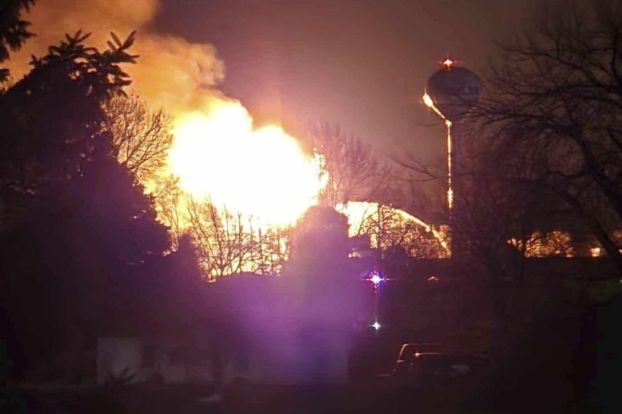 In this photo provided by Madalyn Mickelberg, firefighters from more than a dozen fire departments battle a blaze on Sunday, Feb. 25, 2024, and Monday, Feb. 26, that engulfed and destroyed a grain elevator in Hawley, Minn. Firefighters needed so much water to battle the fire that local officials asked residents to go without water; firefighters' ladder hoses strained the town's water system. (Madalyn Mickelberg via AP)