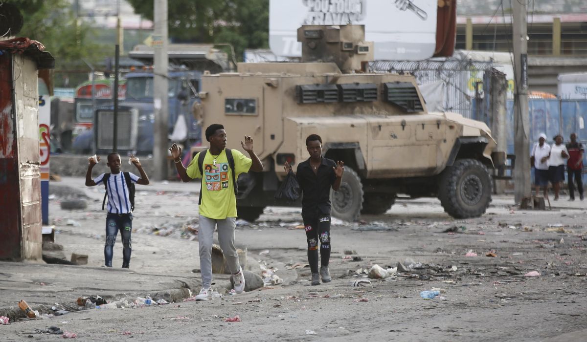 NextImg:Gunfire paralyzes Haiti as powerful gang leader says he will try to detain police chief, ministers