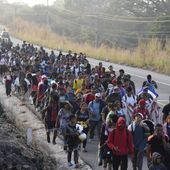 Migrants walk along the highway through Arriaga, Chiapas state in southern Mexico, Monday, Jan. 8, 2024, during their journey north toward the U.S. border. (AP Photo/Edgar H. Clemente)