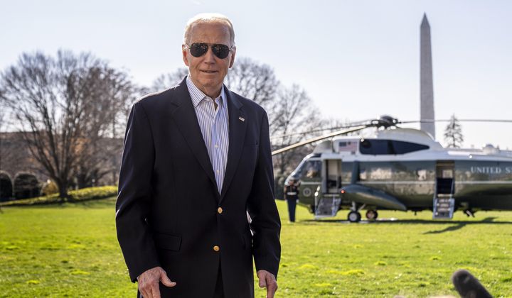 President Joe Biden takes a question from a reporter before boarding Marine One on the South Lawn of the White House in Washington, Thursday, Feb. 29, 2024, for a short trip to Andrews Air Force Base, Md., and then on to Brownsville, Texas. (AP Photo/Andrew Harnik) **FLE**