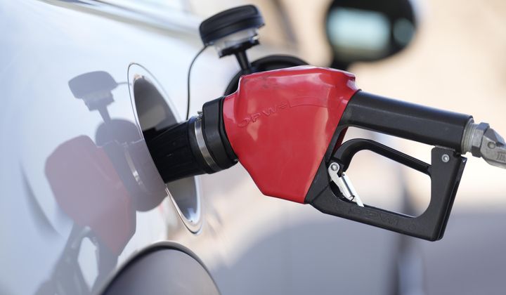 Fuel is pumped into a vehicle at a Costco gasoline station on Nov. 30, 2023, in Thornton, Colo. On Thursday, Feb. 20, 2024, the Commerce Department issues its January report on consumer spending. (AP Photo/David Zalubowski, File)