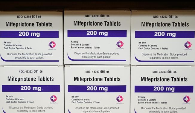 Boxes of the drug mifepristone sit on a shelf at the West Alabama Women&#x27;s Center in Tuscaloosa, Ala., on March 16, 2022. Drugstore chains CVS Health and Walgreens plan to start dispensing the abortion pill mifepristone in a few states. CVS Health will start filling prescriptions for the medication in Rhode Island and neighboring Massachusetts “in the weeks ahead,” spokeswoman Amy Thibault said Friday, March 1, 2024. (AP Photo/Allen G. Breed, File)