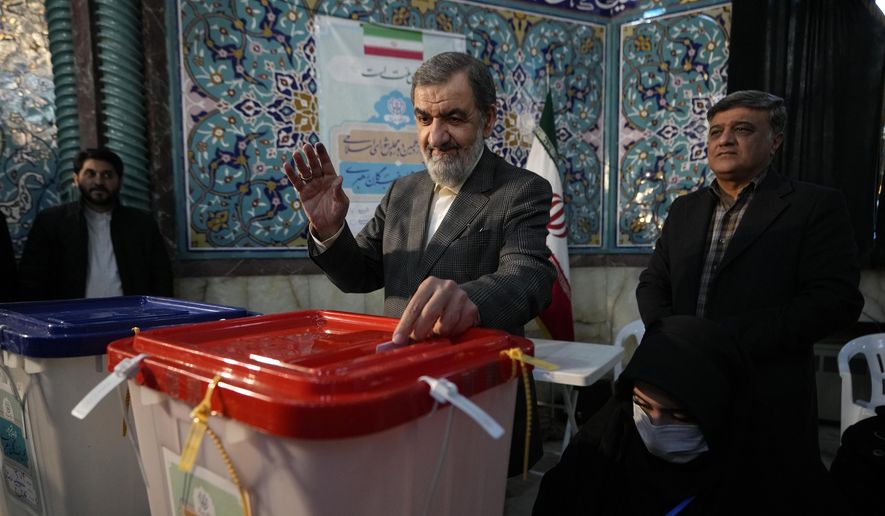Former Revolutionary Guard commander Mohsen Rezaei casts his ballot during the parliamentary and Assembly of Experts elections at a polling station in Tehran, Iran, Friday, March 1, 2024. (AP Photo/Vahid Salemi)