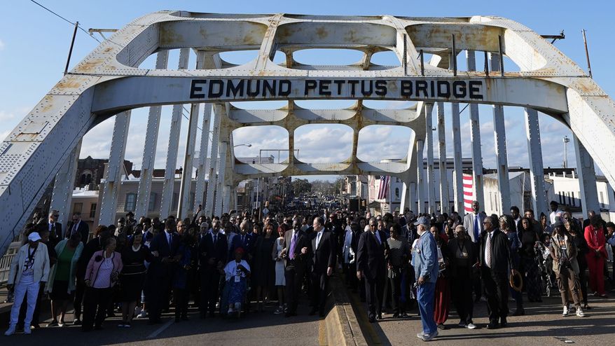 Vice President Kamala Harris and many others walk across the Edmund Pettus Bridge commemorating the 59th anniversary of the Bloody Sunday voting rights march in 1965, Sunday, March 3, 2024, in Selma, Ala. (AP Photo/Mike Stewart)