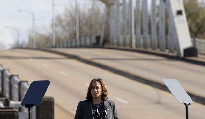 Vice President Kamala Harris speaks before walking with others across the Edmund Pettus Bridge commemorating the 59th anniversary of the Bloody Sunday voting rights march in 1965, Sunday, March 3, 2024, in Selma, Ala. (AP Photo/Mike Stewart)