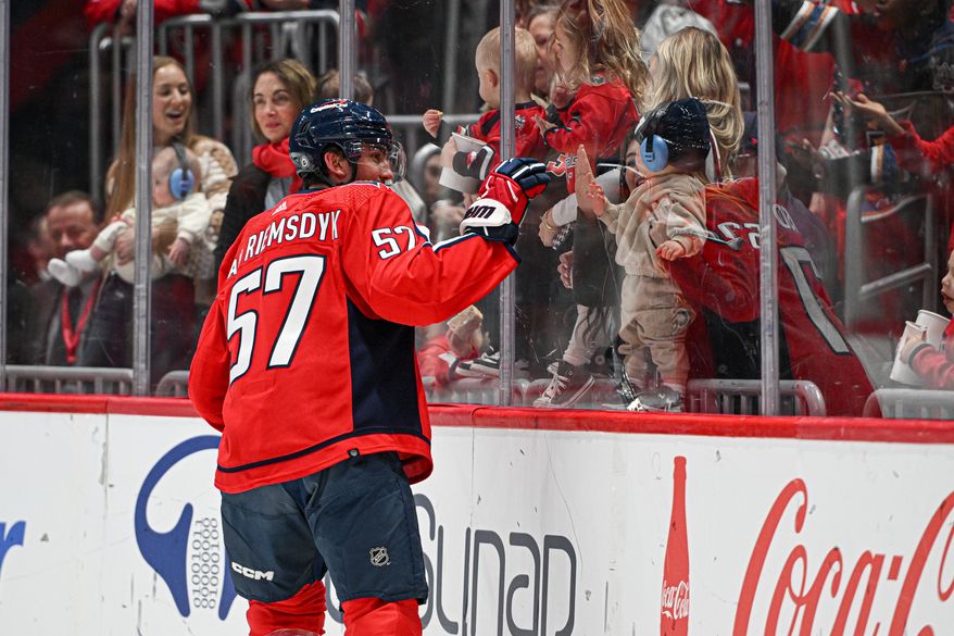 Washington Capitals defenseman Trevor van Riemsdyk (57) waving to his child during pregame warmups before an NHL game against the Arizona Coyotes at Capital One Arena in Washington D.C., March 3, 2024. (Photo by Billy Sabatini)