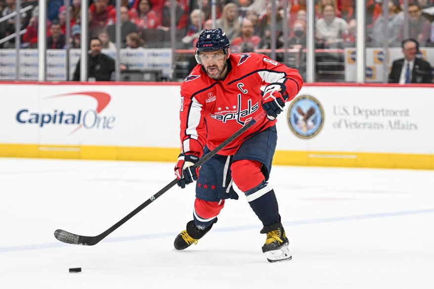 Washington Capitals left wing Alex Ovechkin (8) passing the puck during the first period of an NHL game against the Arizona Coyotes at Capital One Arena in Washington D.C., March 3, 2024. (Photo by Billy Sabatini)