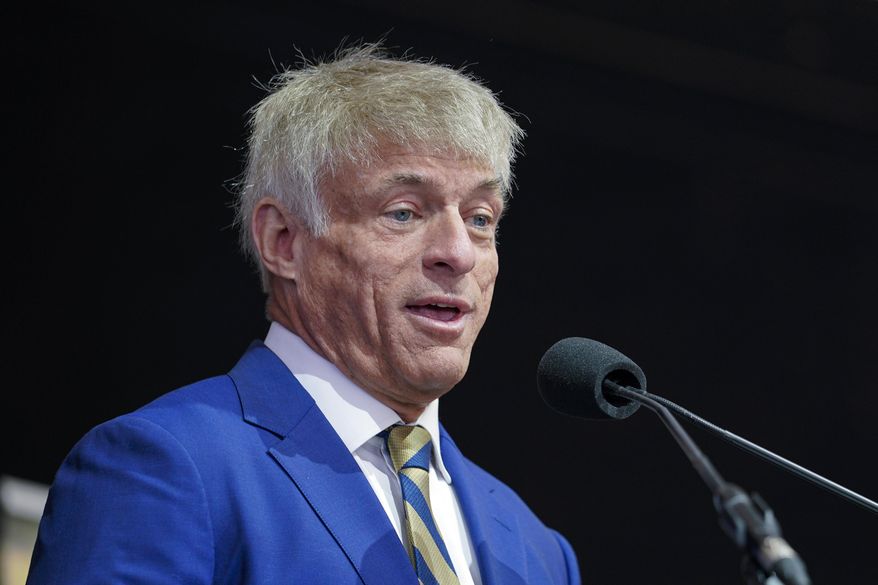 Michael Voris, founder of Church Militant, speaks during a rally, Nov. 16, 2021, in Baltimore. Church Militant, a far-right, unofficial Catholic media website, has agreed to pay $500,000 to a New Hampshire priest who sued for defamation over a 2019 article that it now disavows. The website also is planning to shut down soon, the priest's attorney says. (AP Photo/Julio Cortez, File)