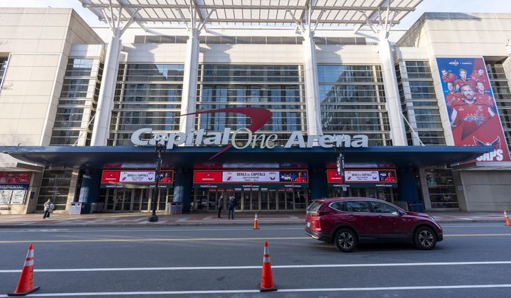 Capitol One Arena is shown before an NHL hockey game between the Washington Capitals and the New Jersey Devils, Tuesday, Feb. 20, 2024, in Washington. The proposed move of the Capitals and Wizards sports teams to nearby Virginia has stoked concern in a pair of fragile Washington neighborhoods. Residents and business owners in Chinatown fear that the departure of the teams would devastate the neighborhood around the Capital One Arena. (AP Photo/Alex Brandon) **FILE**