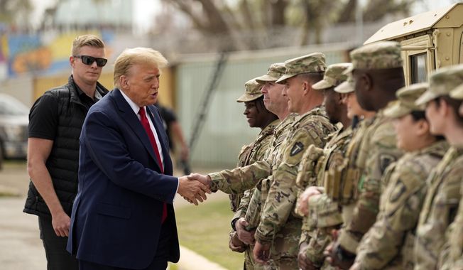 FILE - Republican presidential candidate former President Donald Trump greets members of the National Guard on the U.S.-Mexico border, Feb. 29, 2024, in Eagle Pass, Texas. Recent statements by Trump have fueled Democrats&#x27; sense that there&#x27;s an opening among voters with strong military ties, and progressive veterans&#x27; organizations are working to bridge the gap with what has long been a reliably red constituency. (AP Photo/Eric Gay, File)
