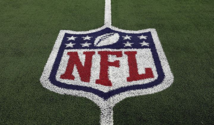 The NFL logo is shown on the field before an NFL football game between the Detroit Lions and the Dallas Cowboys, Saturday, Dec. 30, 2023, in Arlington, Texas. NFL teams are set to dole up billions in free agent contracts in the coming weeks as teams around the league hope that bold moves in March will pay off with wins on the field once the season starts. But in a league with a sharp aging curve and specific systems that don’t suit all players those dollars spent don’t guarantee success. (AP Photo/Matt Patterson, File)