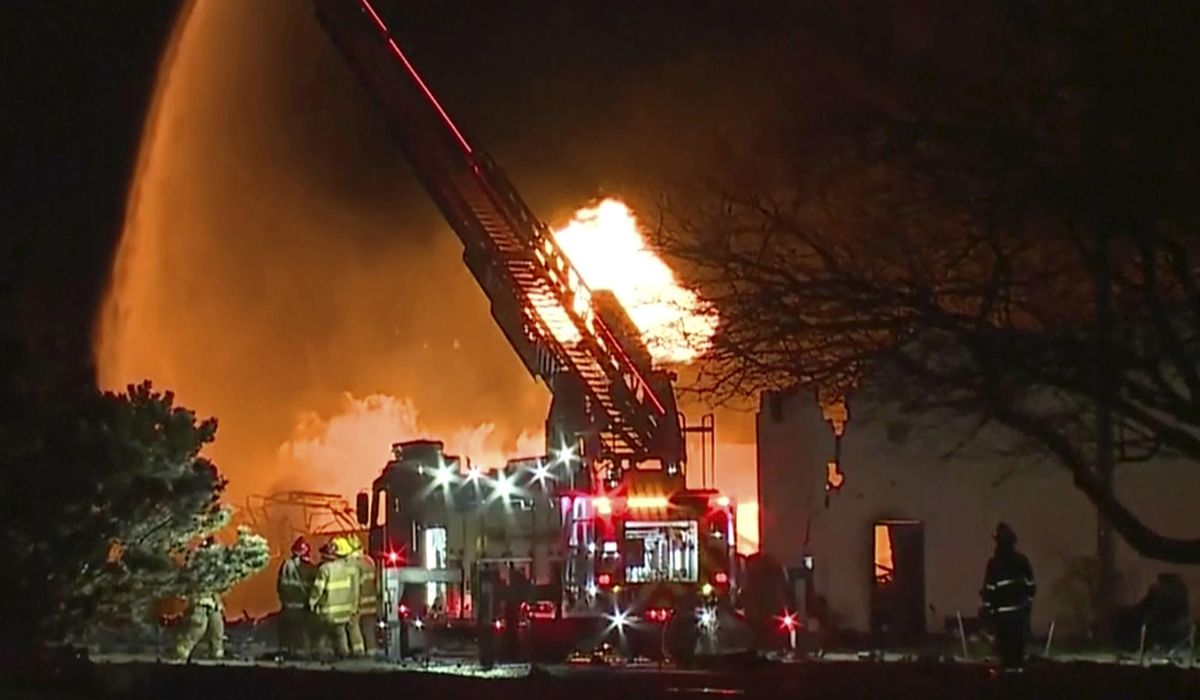 NextImg:Industrial fire and multiple explosions shoot debris into the air in Detroit suburb