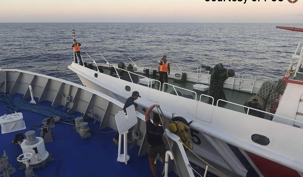 NextImg:Philippine and Chinese vessels collide in disputed South China Sea and 4 Filipino crew are injured