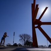 A woman skateboards near a sculpture as she enjoys unseasonably warm weather, Feb. 27, 2024, in Milwaukee. Earth has exceeded global heat records in February, according to the European Union climate agency Copernicus. (AP Photo/Morry Gash) **FILE**