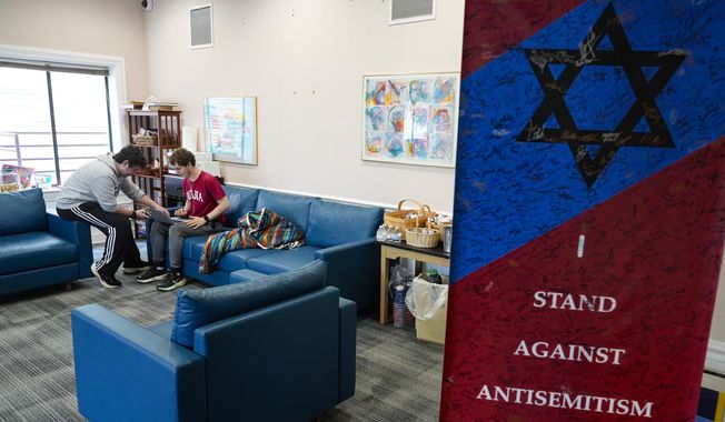 Jewish students gather at the Helene G. Simon Hillel Center at Indiana University in Bloomington, Ind., Tuesday, Feb. 13, 2024. An Indiana bill to address antisemitism on college campuses lost support from some members of the Jewish community after an amendment altered language surrounding criticism of Israel. (AP Photo/Michael Conroy) ** FILE **