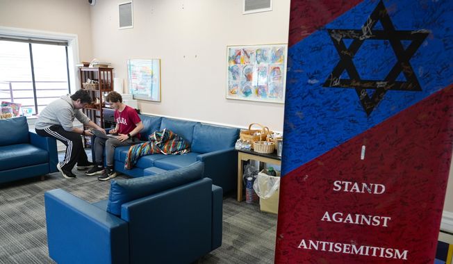 Jewish students gather at the Helene G. Simon Hillel Center at Indiana University in Bloomington, Ind., Tuesday, Feb. 13, 2024. An Indiana bill to address antisemitism on college campuses lost support from some members of the Jewish community after an amendment altered language surrounding criticism of Israel. (AP Photo/Michael Conroy) **FILE**