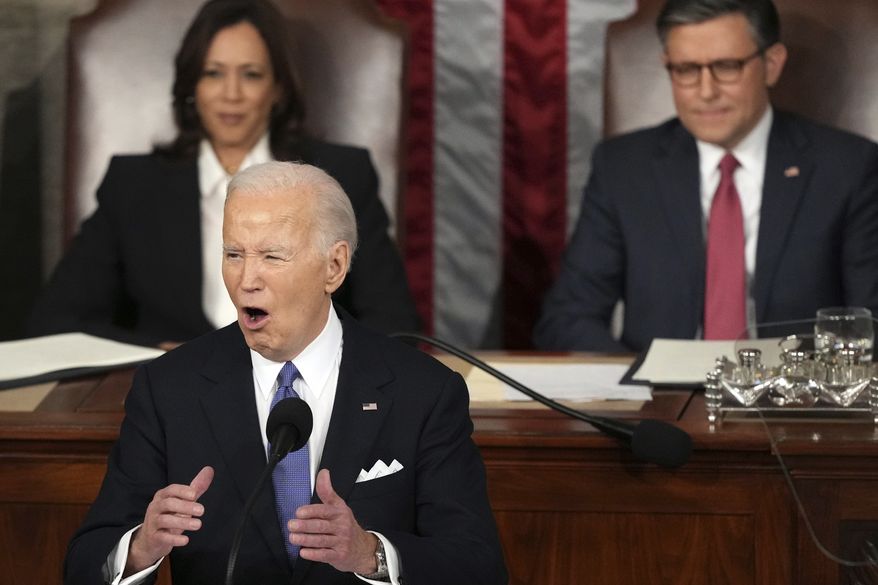 President Joe Biden delivers the State of the Union address to a joint session of Congress at the U.S. Capitol, Thursday March 7, 2024, in Washington, as Vice President Kamala Harris and House Speaker Mike Johnson of La., listen. (AP Photo/Andrew Harnik)