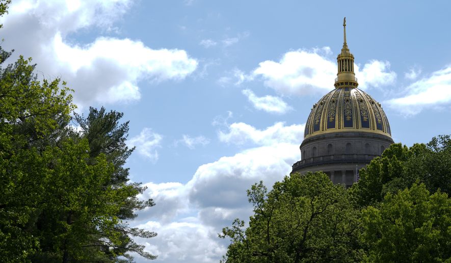 FILE - The West Virginia Capitol is seen, May 4, 2023, in Charleston, W.Va. West Virginia's Republican-controlled state House of Delegates voted Thursday, March 7, 2024, to ban smoking in cars when children are present. (AP Photo/Jeff Dean, File)