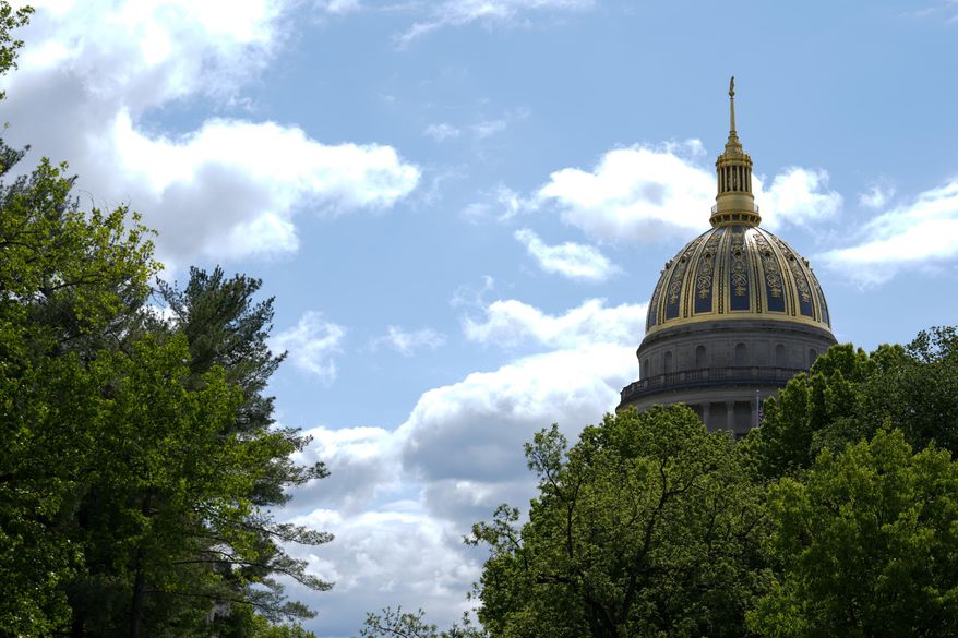 FILE - The West Virginia Capitol is seen, May 4, 2023, in Charleston, W.Va. West Virginia's Republican-controlled state House of Delegates voted Thursday, March 7, 2024, to ban smoking in cars when children are present. (AP Photo/Jeff Dean, File)