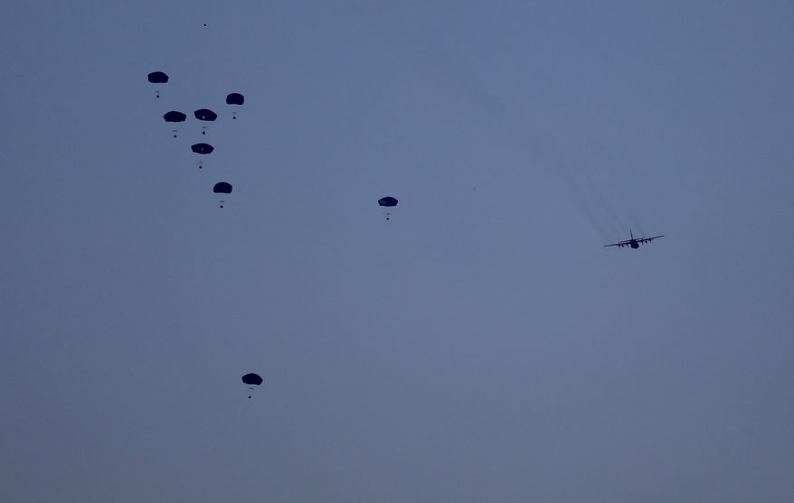 Humanitarian aid is dropped by the United States over Gaza City, Gaza Strip, on Saturday, March 2, 2024. (AP Photo/Mohammed Hajjar, File)