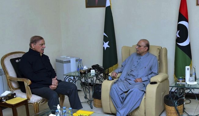 In this photo released by Prime Minister&#x27;s Office, Prime Minister Shehbaz Sharif, left, meets with newly elected Pakistan&#x27;s President Asif Ali Zardari, in Islamabad, Pakistan, Saturday, March 9, 2023. Pakistan&#x27;s lawmakers have chosen Zardari as the country&#x27;s new president. It&#x27;s his second time in the job. Zardari is the widower of assassinated former Premier Benazir Bhutto and the father of former Foreign Minister Bilawal Bhutto-Zardari, (Prime Minister Office via AP) ** FILE **