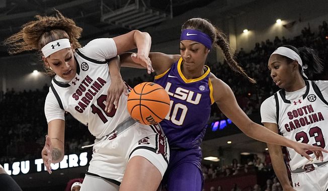 South Carolina center Kamilla Cardoso vies for the ball with LSU forward Angel Reese during the first half of an NCAA college basketball game at the Southeastern Conference women&#x27;s tournament final Sunday, March 10, 2024, in Greenville, S.C. (AP Photo/Chris Carlson)