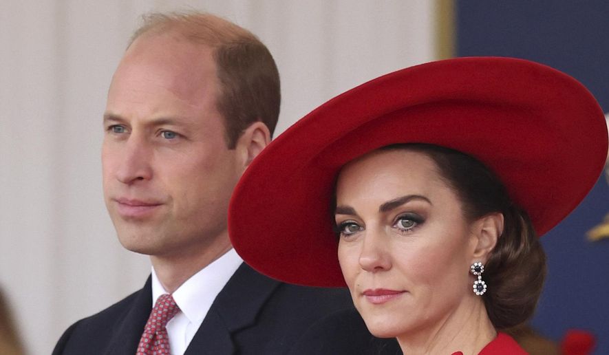 Britain's Prince William, left, and Britain's Kate, Princess of Wales, attend a ceremonial welcome for the President and the First Lady of the Republic of Korea at Horse Guards Parade in London, England on Nov. 21, 2023. Attention on Princess Kate has reached levels not seen since she married Prince William in a fairy-tale wedding in 2011. An admission from Kate that she altered an official family photo triggered a backlash. (Chris Jackson/Pool Photo via AP, File)