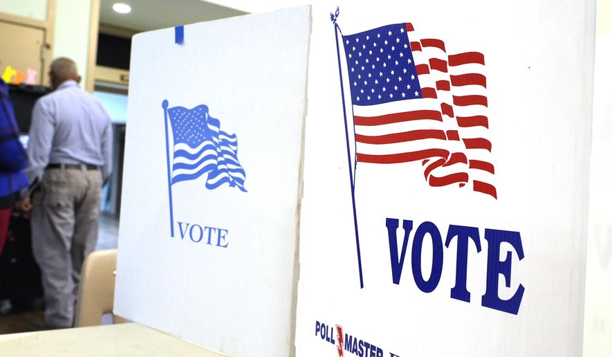 A voter drops off his paper ballot into an electronic ballot box at this north Jackson, Miss., election precinct during Mississippi's party primaries, Tuesday, March 12, 2024. (AP Photo/Rogelio V. Solis) ** FILE **
