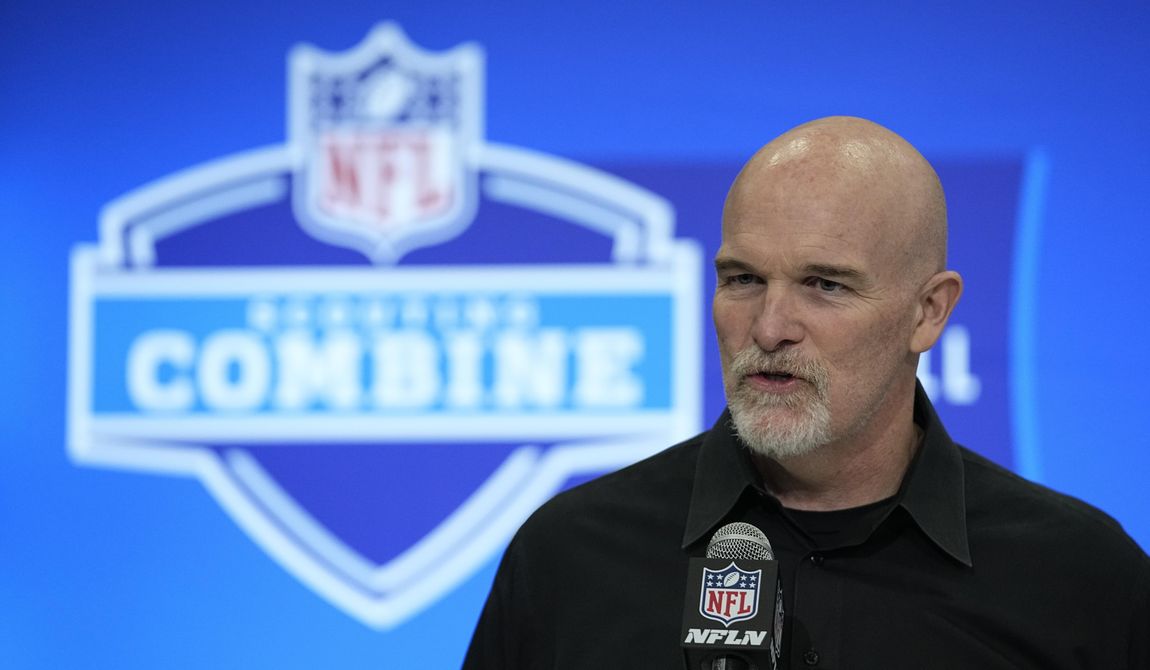 Washington Commanders head coach Dan Quinn speaks during a news conference at the NFL football scouting combine, Tuesday, Feb. 27, 2024, in Indianapolis. (AP Photo/Darron Cummings)