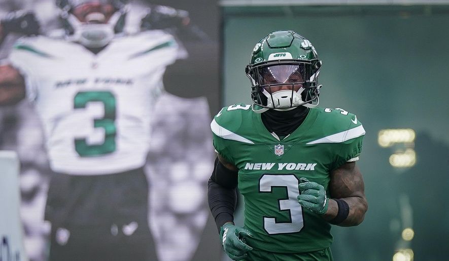 New York Jets safety Jordan Whitehead (3) runs before an NFL football game against the Washington Commanders on Dec. 24, 2023, in East Rutherford, N.J. Whitehead and the Tampa Bay Buccaneers have agreed on a two-year, $9 million contract worth up to $10.5 million, a person familiar with the deal told The Associated Press. (AP Photo/Bryan Woolston, file)