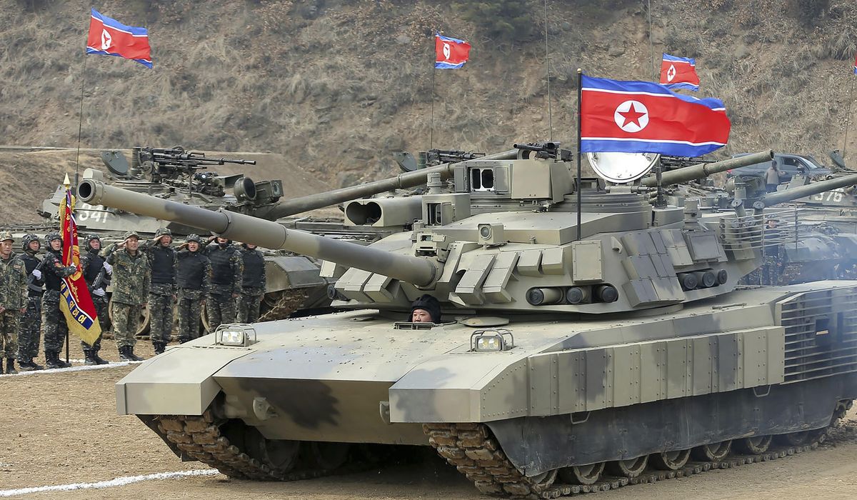 NextImg:North Korea’s Kim test drives a new tank and orders troops to prepare for war