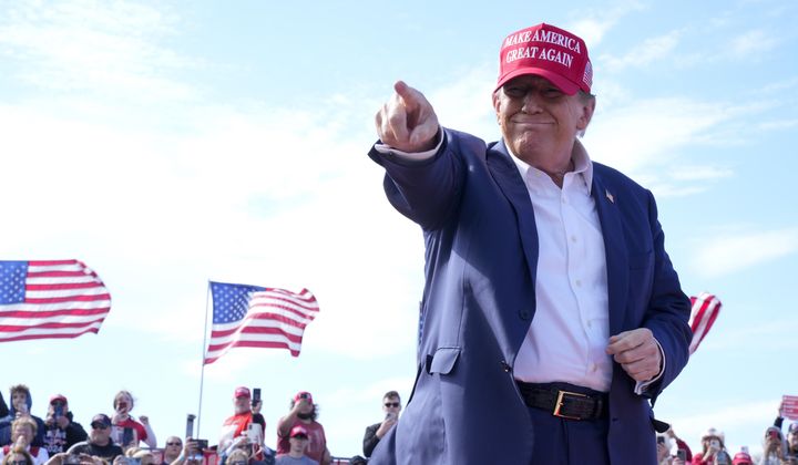 Republican presidential candidate former President Donald Trump gestures to the crowd at a campaign rally Saturday, March 16, 2024, in Vandalia, Ohio. (AP Photo/Jeff Dean)