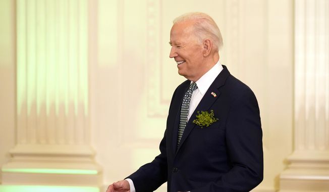 President Joe Biden greets attendees at a St. Patrick&#x27;s Day brunch with Catholic leaders in the East Room of the White House, Sunday, March 17, 2024. (AP Photo/Stephanie Scarbrough)