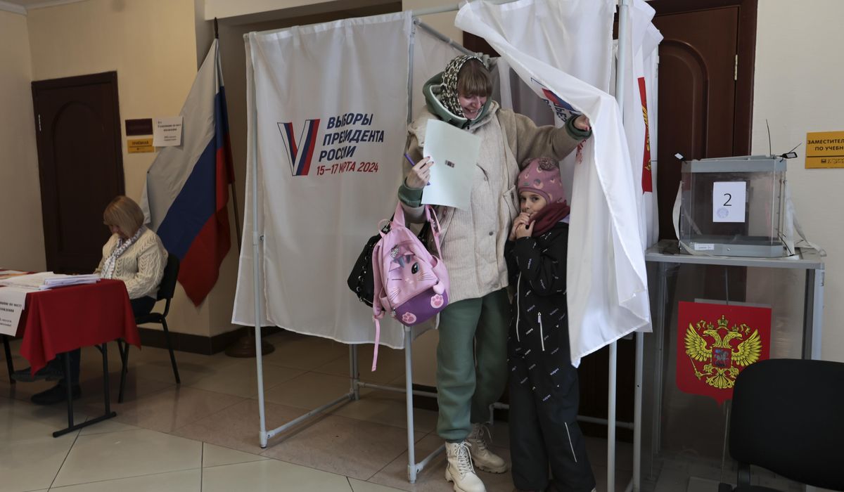 NextImg:Russians crowd polling stations in apparent protest as Putin is set to extend his rule