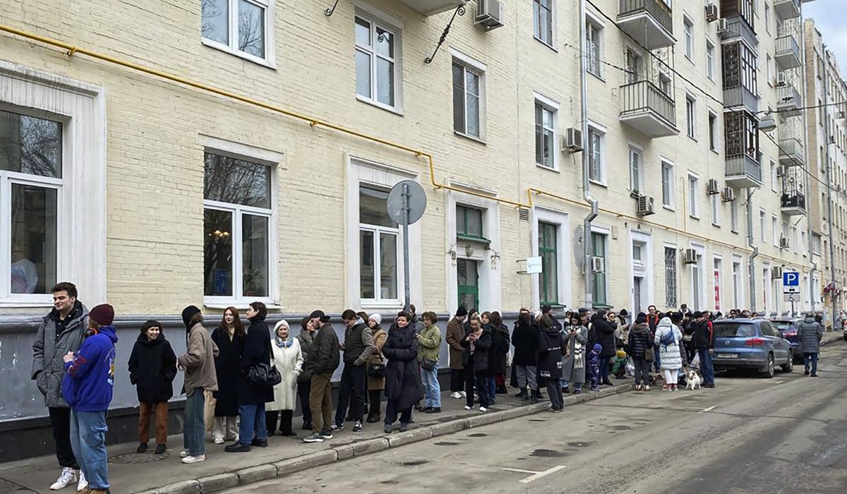 NextImg:Protesters adopt tactic of late Navalny to register protest to Putin re-election