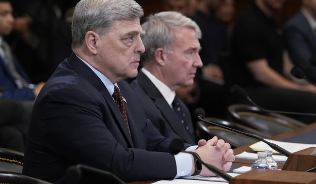 Retired Gen. Mark A. Milley, left, the former chairman of the Joint Chiefs of Staff, left, and retired Gen. Kenneth McKenzie, former commander of the U.S. Central Command, speak to the House Foreign Affairs Committee about the U.S. withdrawal from Afghanistan, at the Capitol in Washington, Tuesday, March 19, 2024. (AP Photo/J. Scott Applewhite)