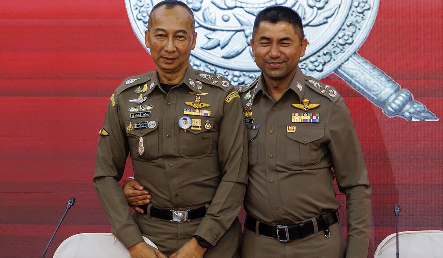 Chief Royal Thai Police Torsak Sukvimol, left, Duputy Chief the royal Thai Police Surachate Hakparn, embrace after a press conference in Bangkok, Thailand, Wednesday, March 20, 2024. Thailand&#x27;s national police chief and a deputy were ordered to be suspended by the Prime Minister on Wednesday, following a feud that escalated over the past few weeks pointing to serious conflicts within the highest echelons of the police department. (AP Photo/Pirun Nanta)