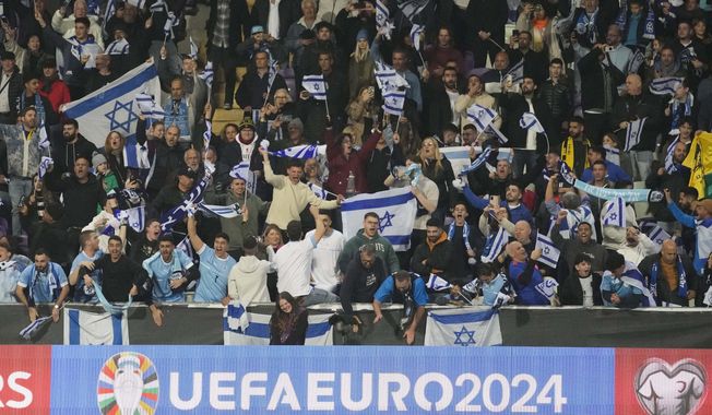Israel supporters cheer during the Euro 2024 qualifying play-off soccer match between Israel and Iceland, at Szusza Ferenc Stadium in Budapest, Hungary, Thursday, March 21, 2024. (AP Photo/Darko Vojinovic)