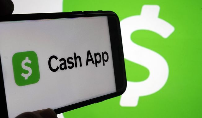 Logos for Cash App are shown on devices in New York, Sept. 8, 2023. Tax reporting requirements for freelancers or gig workers who receive payments via apps like Venmo, Zelle, Cash App or PayPal will change for the 2024 tax year. (AP Photo/Richard Drew, File)