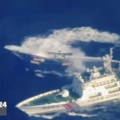 In this screen grab from video provided by the Armed Forces of the Philippines, a Chinese coast guard ship uses water cannon on a Philippine resupply vessel Unaizah May 4 as it approaches Second Thomas Shoal, locally called Ayungin shoal, at the disputed South China Sea on Saturday, March 23, 2024. (Armed Forces of the Philippines via AP)