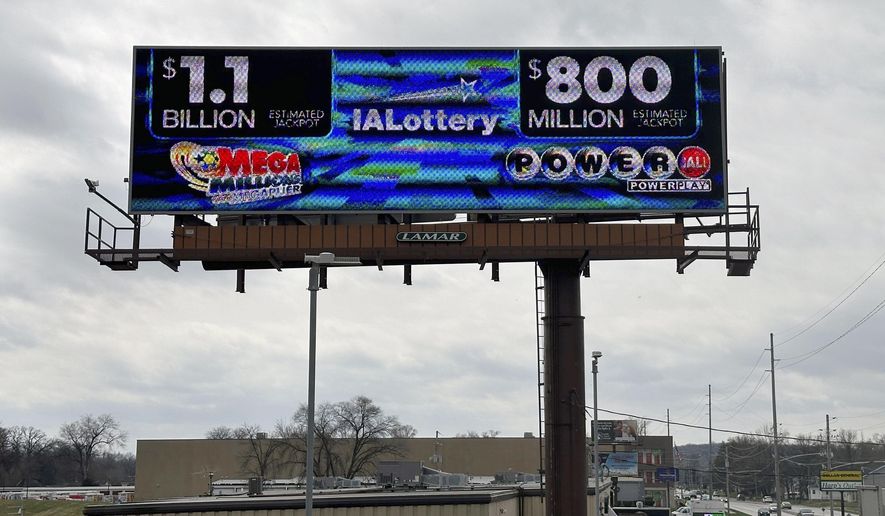 An electronic billboard advertises the Mega Millions and Powerball jackpots, Monday, March 25, 2024, in in Des Moines, Iowa, that when combined amount to nearly $2 billion. It's the first time the two lottery games each have jackpots of $800 million or more. (AP Photo/Scott McFetridge)