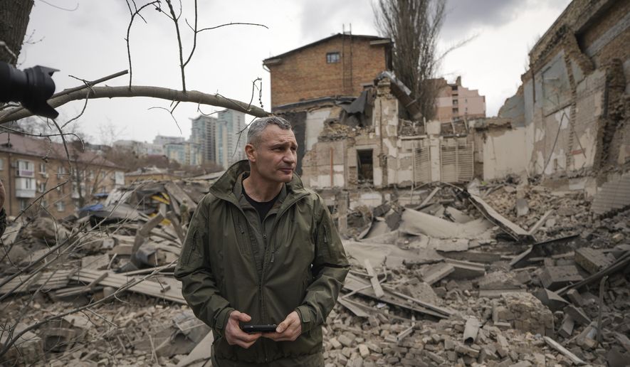 Kyiv Mayor Vitali Klitschko inspects the are of a Russian attack at the Pechersk district react in Kyiv, Ukraine, Monday March 25, 2024. Five people were injured in the strike, two were hospitalised.(AP Photo/Vadim Ghirda)