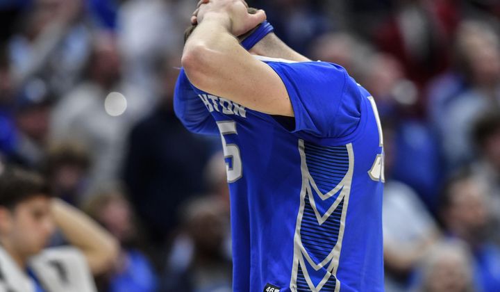 FILE - Creighton guard Baylor Scheierman (55) reacts to losing to San Diego State after a Elite 8 college basketball game in the South Regional of the NCAA Tournament, Sunday, March 26, 2023, in Louisville, Ky. San Diego State won 57-56. Hands on his head with the front of his jersey pulled up to cover his face, Baylor Scheierman was the picture of Creighton&#x27;s raw emotion in the immediate aftermath of its crushing loss in the NCAA Elite last year. That loss to San Diego State denied the Bluejays of their first Final Four and made Scheierman&#x27;s decision to come back to college for a fifth year a lot easier.(AP Photo/Timothy D. Easley, File)